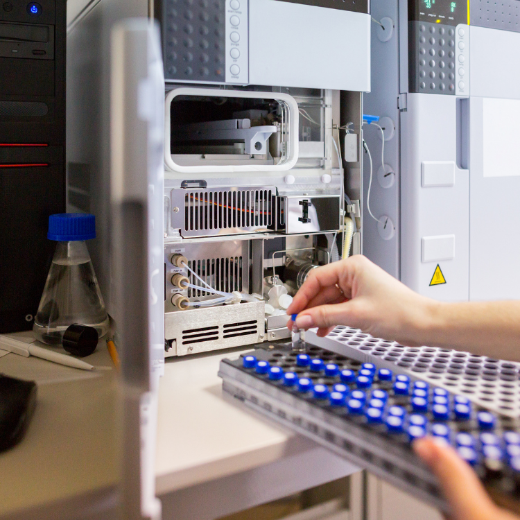 Expert scientist preparing LC-MS grade vials for high sensitivity analysis